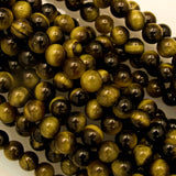 Semi prec 6mm rnd tiger eye nat 34pcs