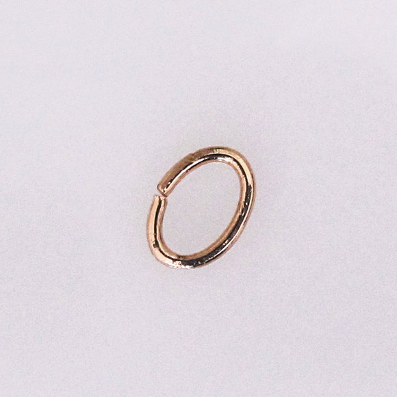 Metal 7x5x.8mm oval jumpring NF Gold 50p