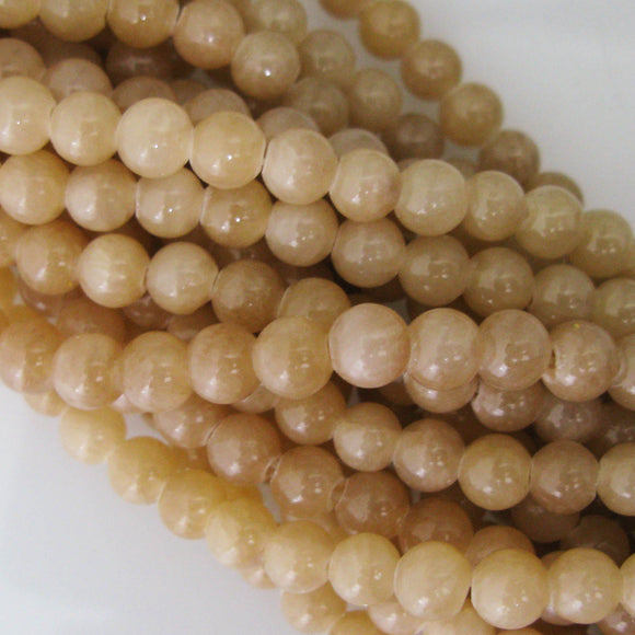 Semi prec 6mm rnd dyed op jade latte 65pcs.