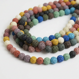 Mixed-colour lava beads arranged in curved strands