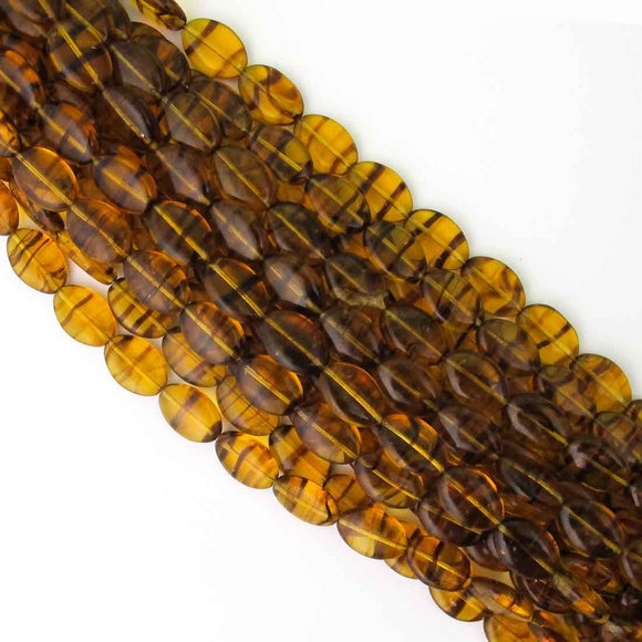 cz 16x11mm flat oval trns amber/blk 16pc