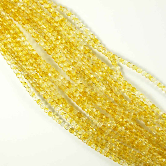 Cz 4mm rnd facet 2tone clear amber 50pc