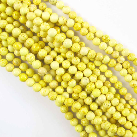 semi prec 6mm rnd hite lgt yelllow 60+p.